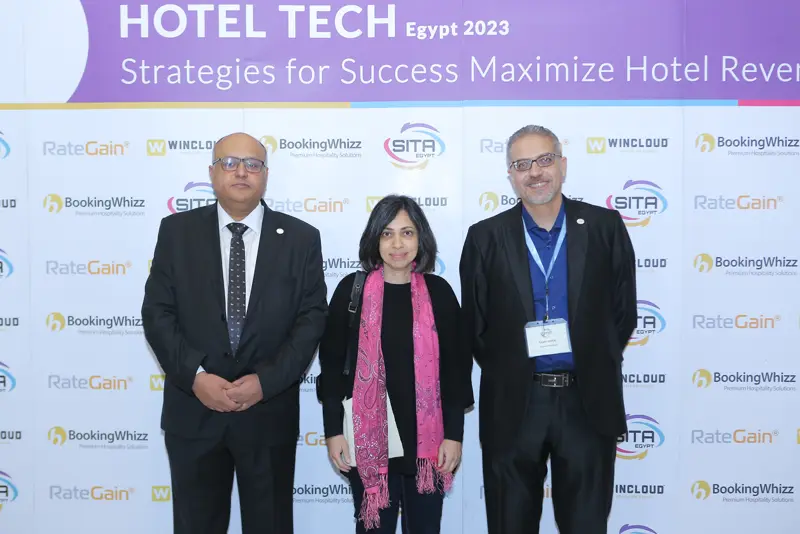 Guests at the Hotel Tech 2023 backdrop
