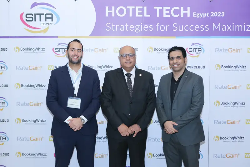Guests at the Hotel Tech 2023 backdrop