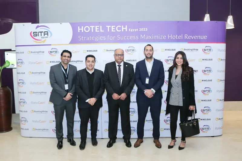 Guests at the Hotel Tech 2023 backdrop