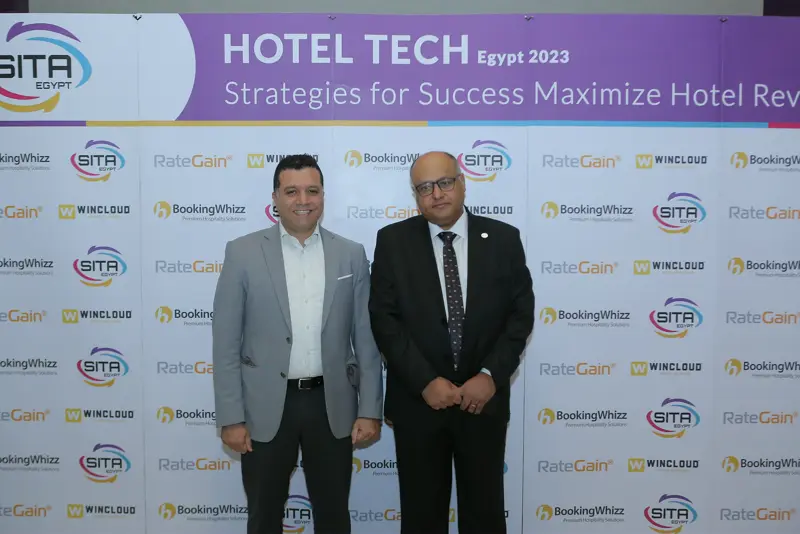 Guests at the Hotel Tech 2023 backdrop