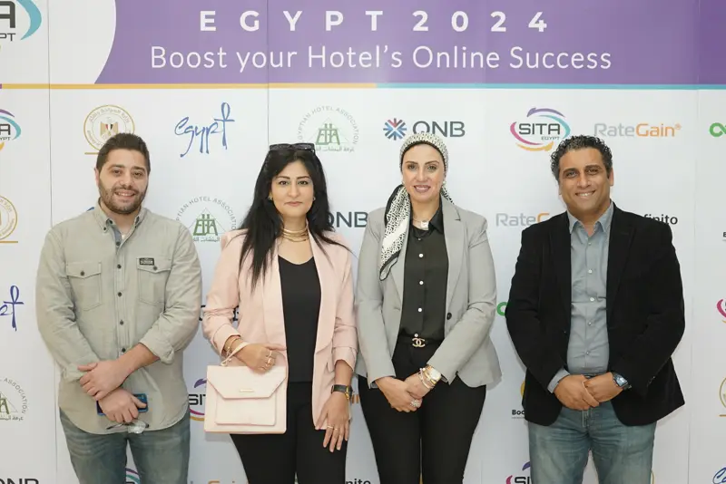 Guests at the Hotel Tech 2024 backdrop