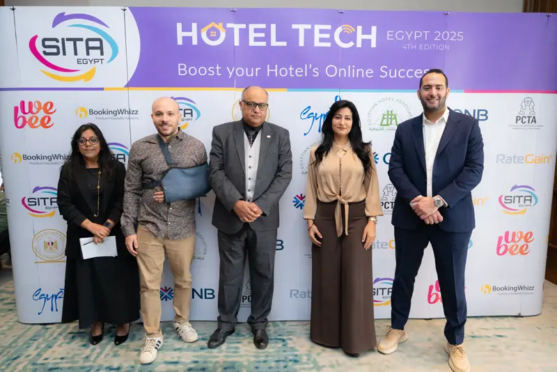 Guests at the Hotel Tech 2025 backdrop
